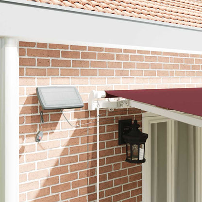 vidaXL Manual Retractable Awning with LED Burgundy 600x300 cm