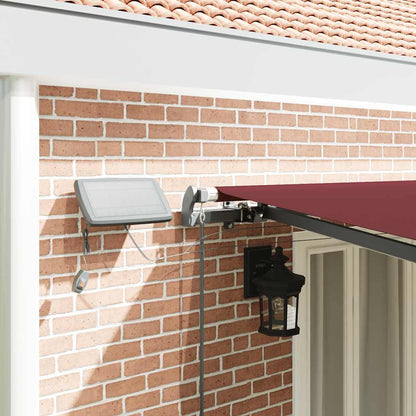 vidaXL Manual Retractable Awning with LEDs Burgundy 600x300 cm